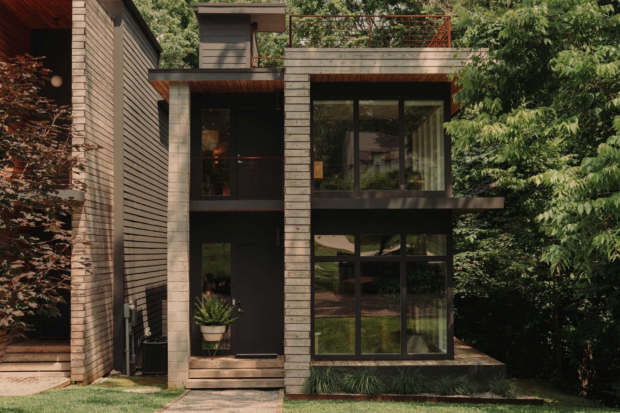 a front view of a house with garden