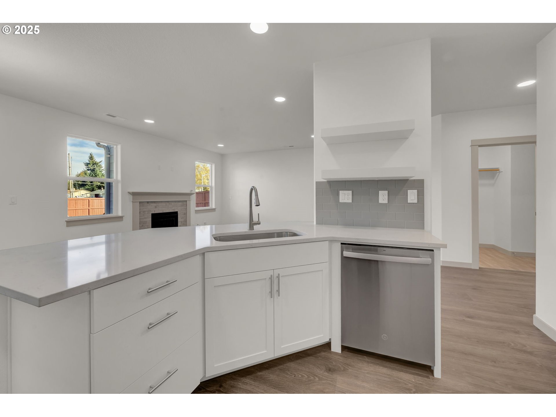 5645 Magnificence Way Eugene, OR 97402 - Photo 11 of 38 a kitchen with white cabinets and sink