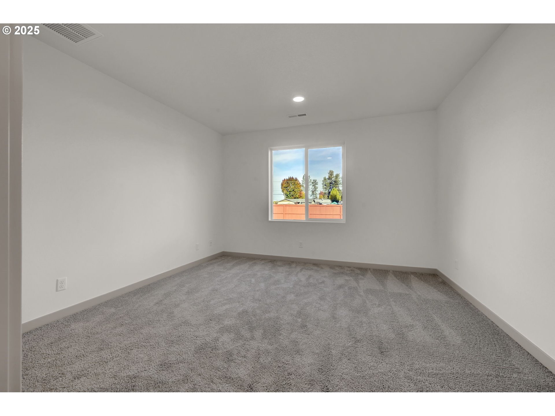 5645 Magnificence Way Eugene, OR 97402 - Photo 14 of 38 a view of an empty room and a window