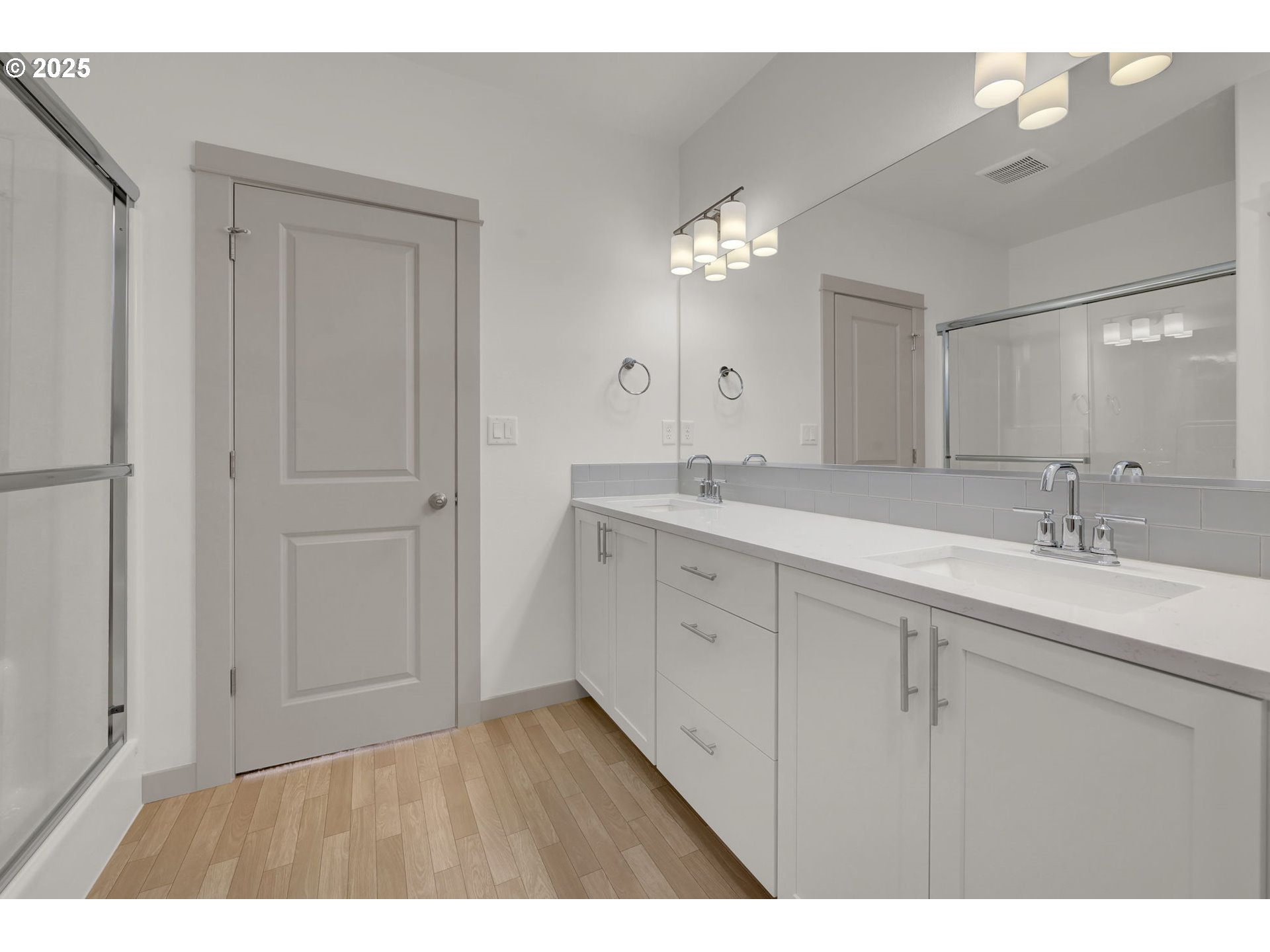 5645 Magnificence Way Eugene, OR 97402 - Photo 17 of 38 a bathroom with a sink vanity and a mirror