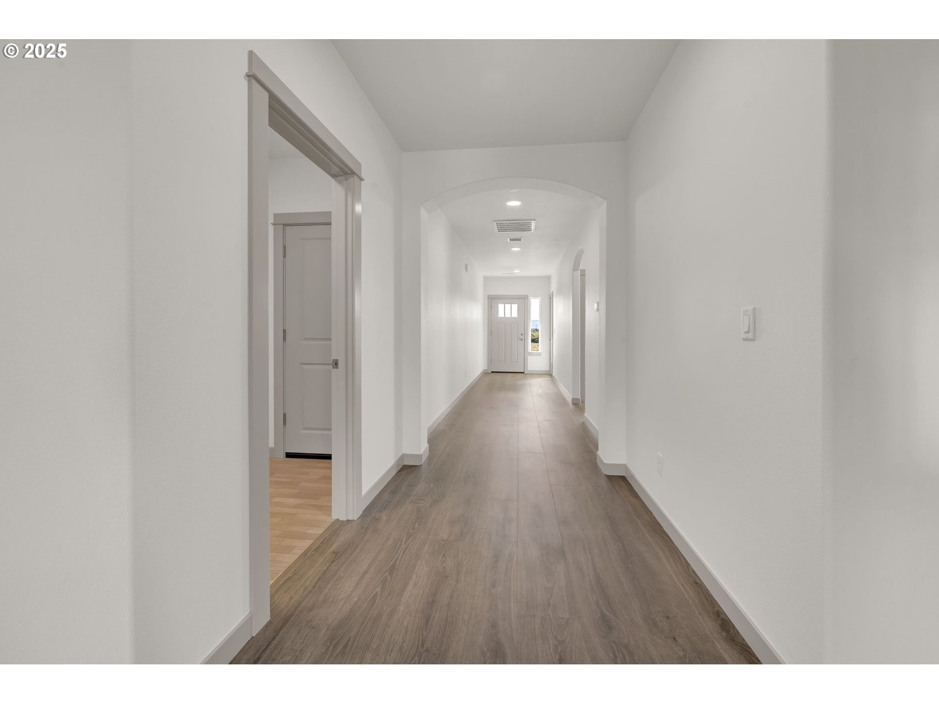 5645 Magnificence Way Eugene, OR 97402 - Photo 19 of 38 a open hall with wooden floor