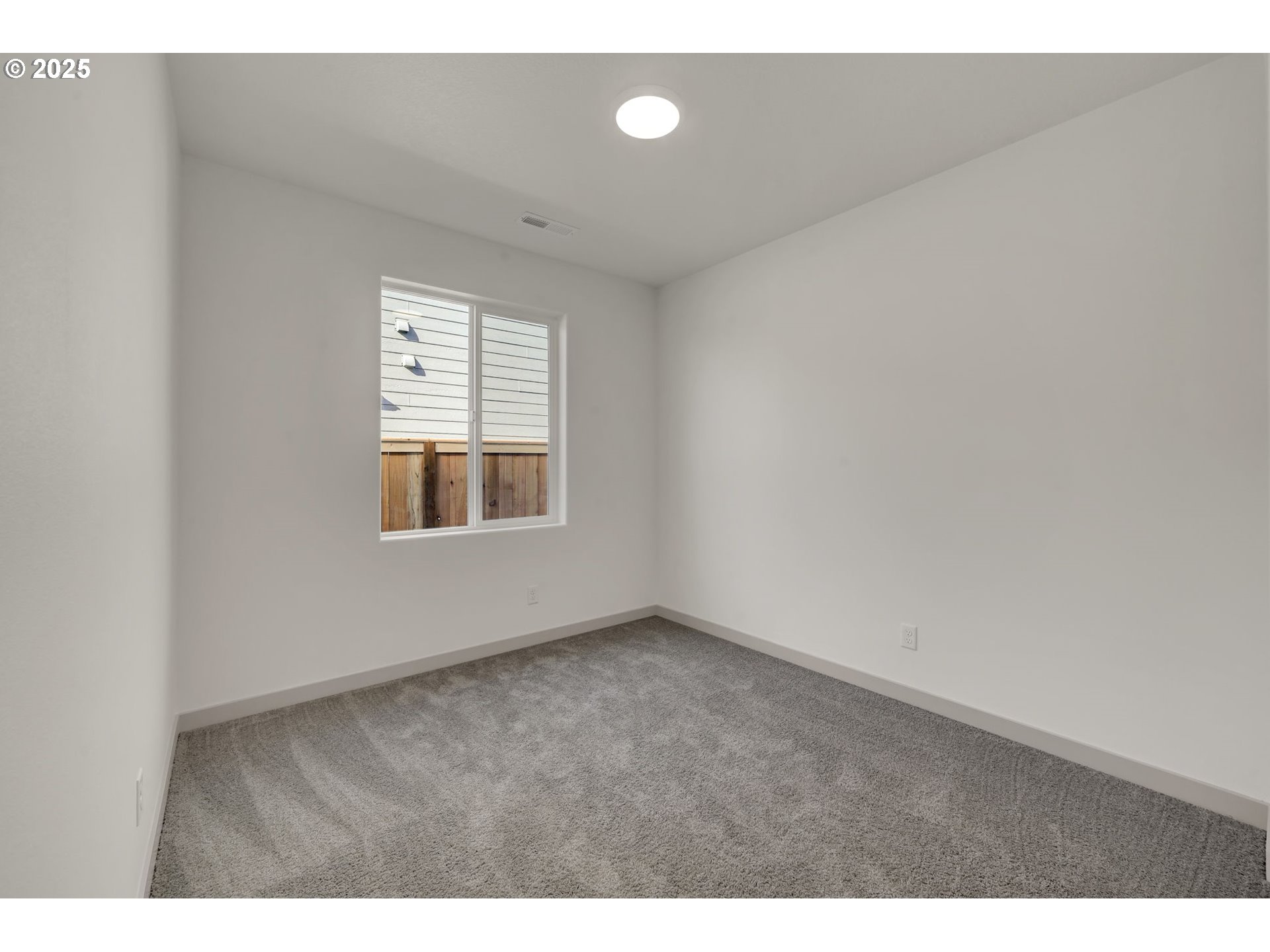 5645 Magnificence Way Eugene, OR 97402 - Photo 26 of 38 a view of an empty room with a window