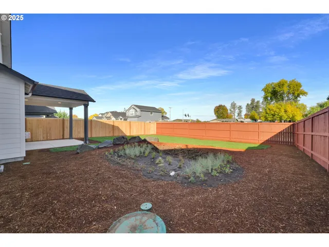a view of a yard with an outdoor space
