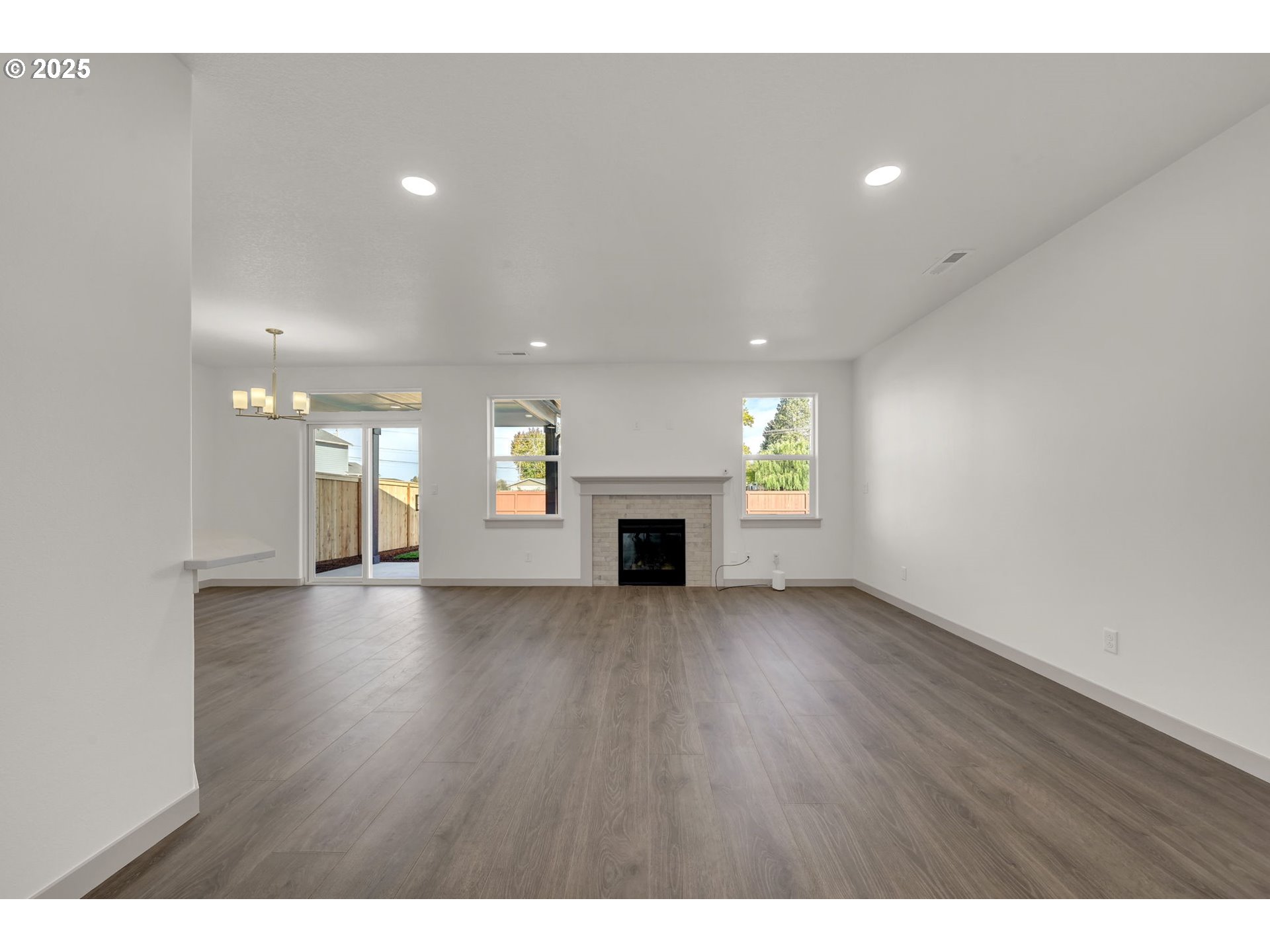 5645 Magnificence Way Eugene, OR 97402 - Photo 37 of 38 a view of an empty room with a fireplace and window