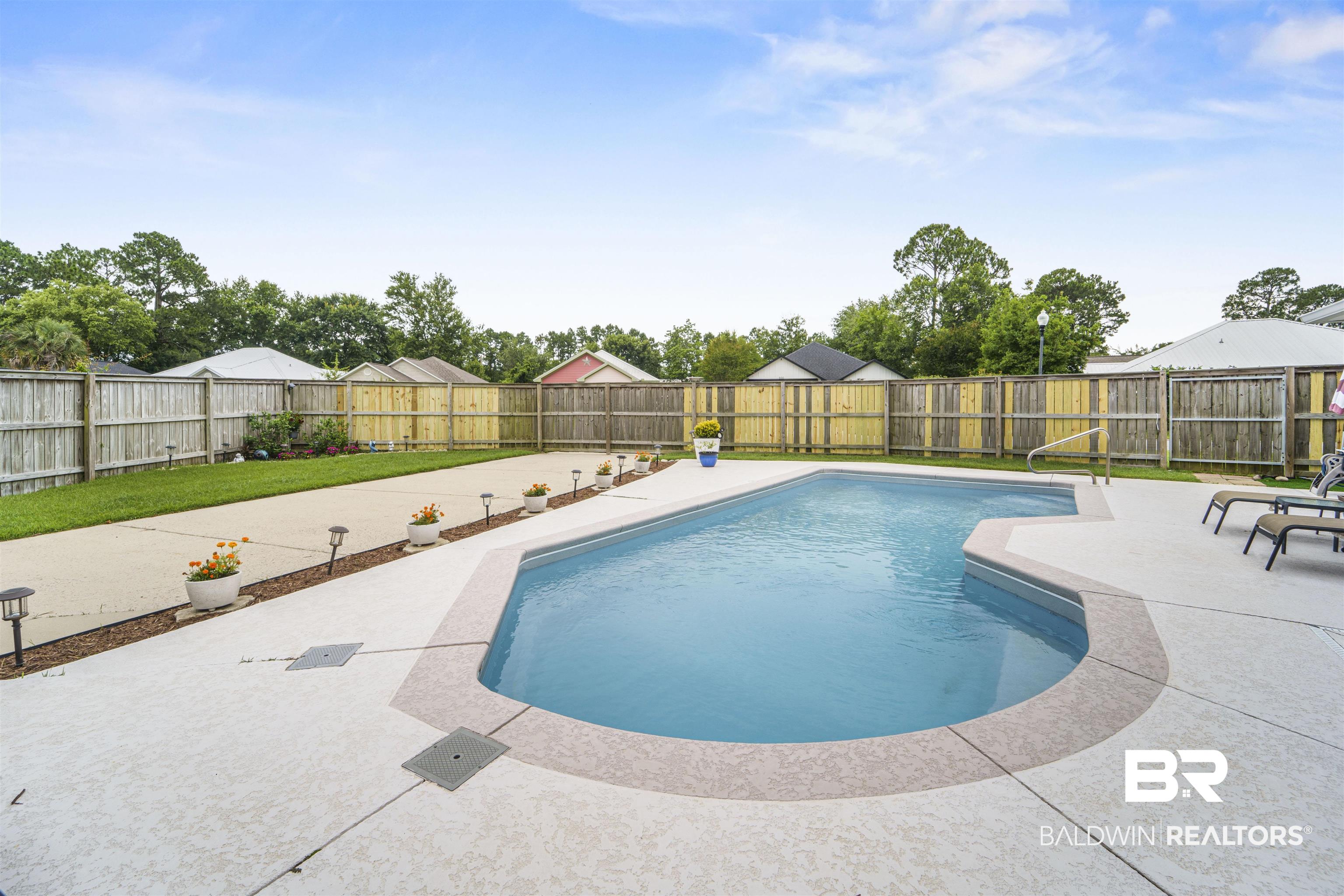 4620 Pine Boulevard Orange Beach, AL 36561 - Photo 31 of 49 View of swimming pool with a patio area and a fenced backyard