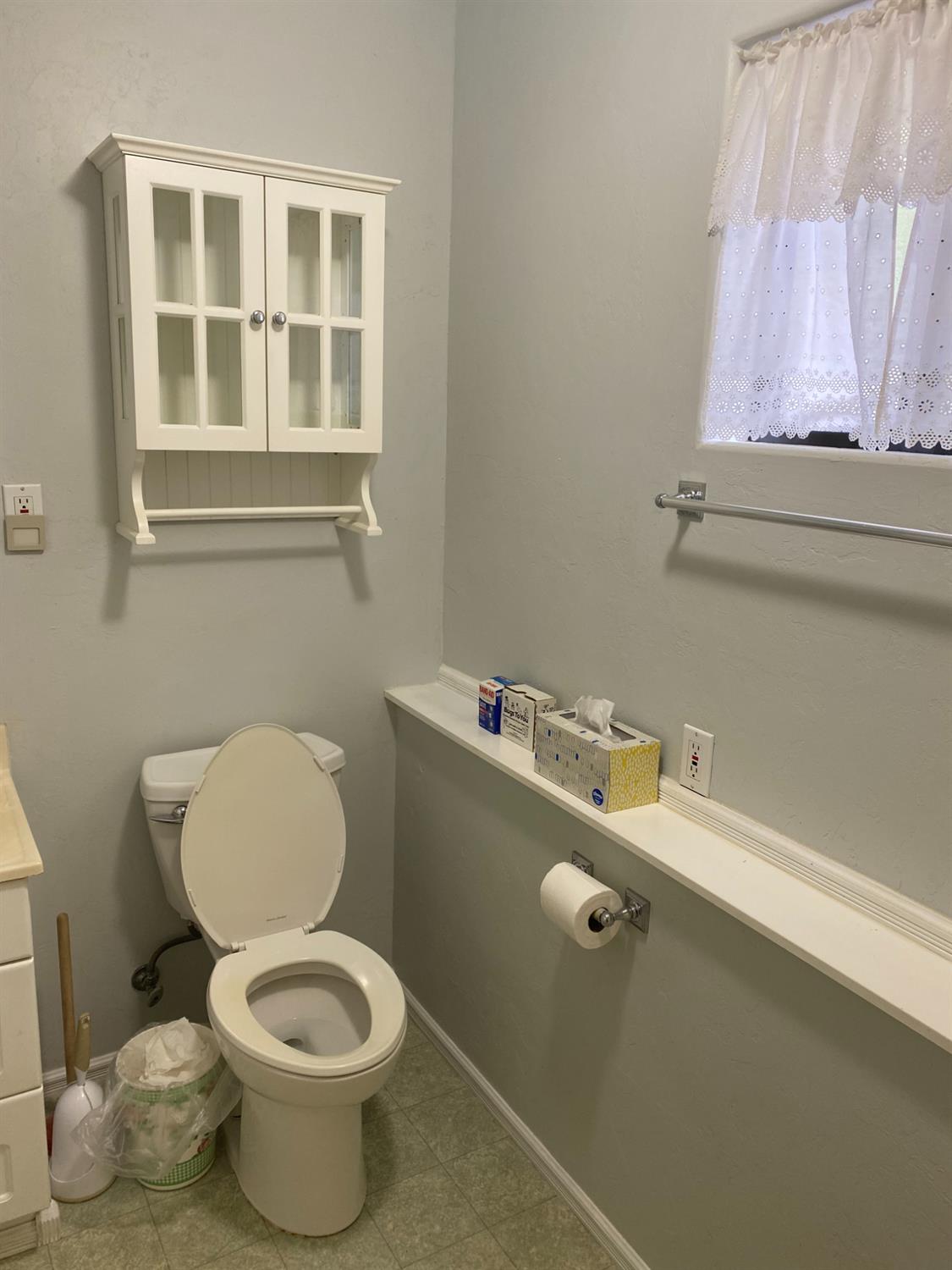5021 Banbury Cross Road Shingle Springs, CA 95682 - Photo 34 of 92 Down stairs bathroom cabinet, window and counter.