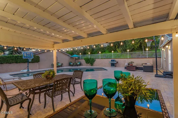 a view of an chairs and table in patio