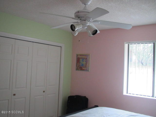 1171 Circulo Golfo Rio Rico, AZ 85648 - Photo 9 of 17 a bathroom with a window and a fan