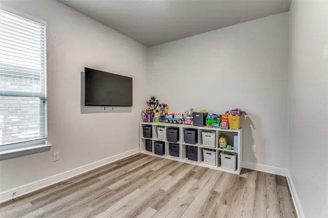 a room with furniture and a flat screen tv