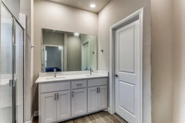 a spacious bathroom with a double vanity sink mirror and
