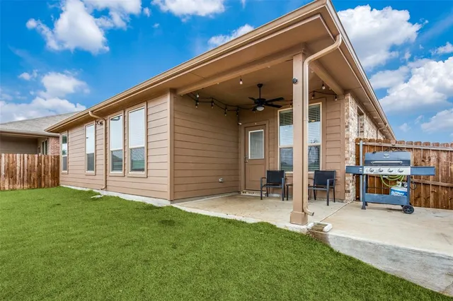 a backyard of a house with seating space