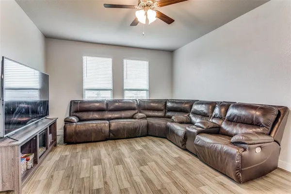 a living room with a couch and a flat screen tv