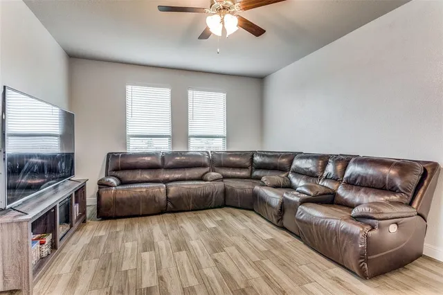 a living room with a couch and a flat screen tv