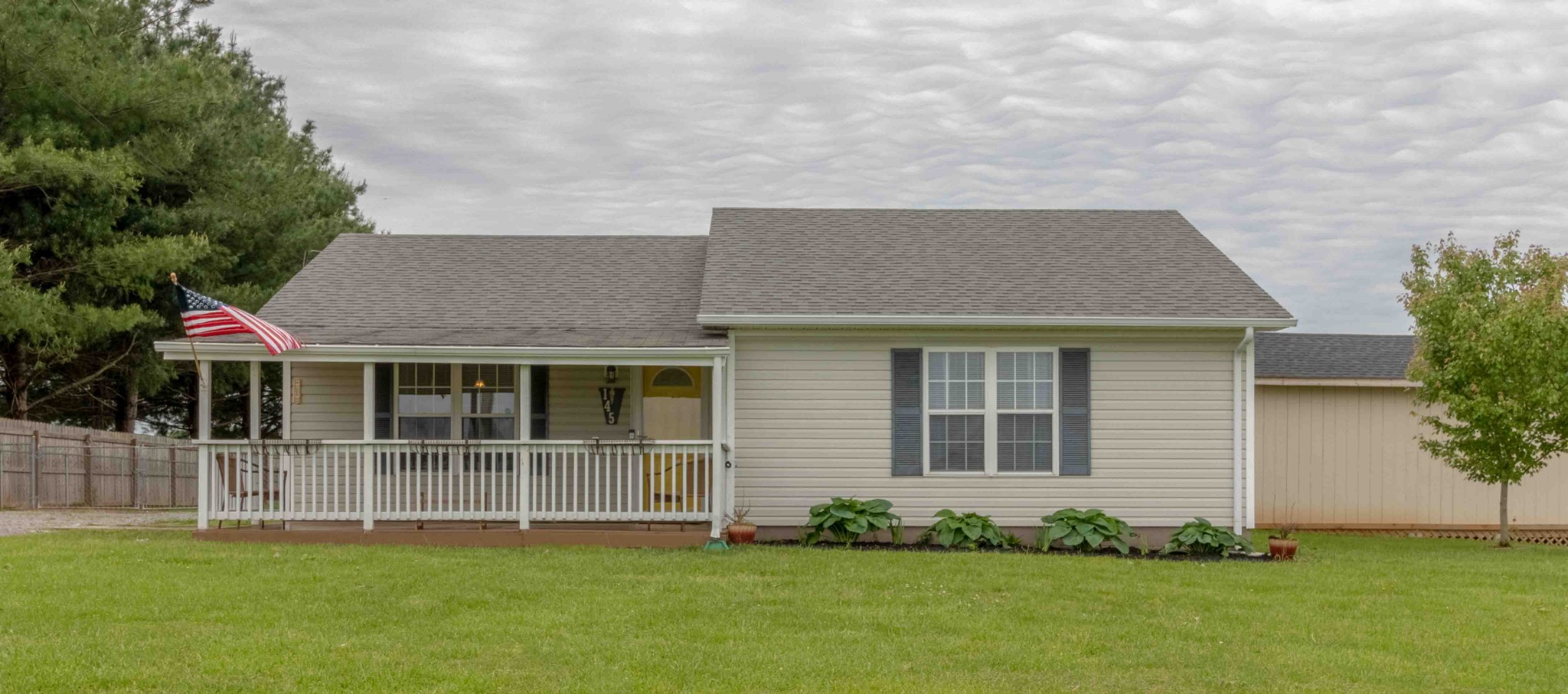 145 Bumpus Mill Road Oak Grove, KY 42262 - Photo 1 of 31 a front view of a house with a garden