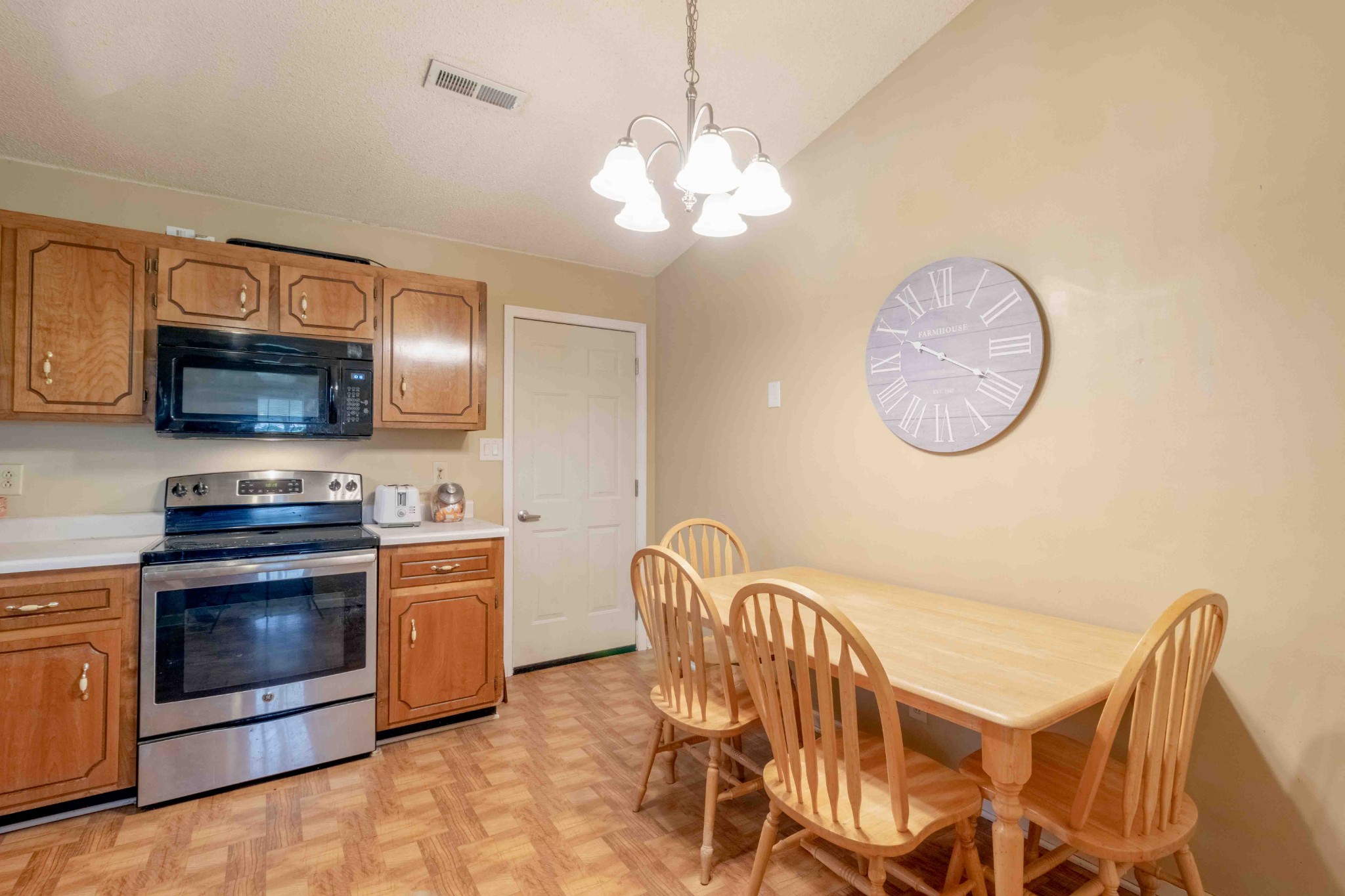 145 Bumpus Mill Road Oak Grove, KY 42262 - Photo 12 of 31 a view of dining room and kitchen with furniture wooden floor and window