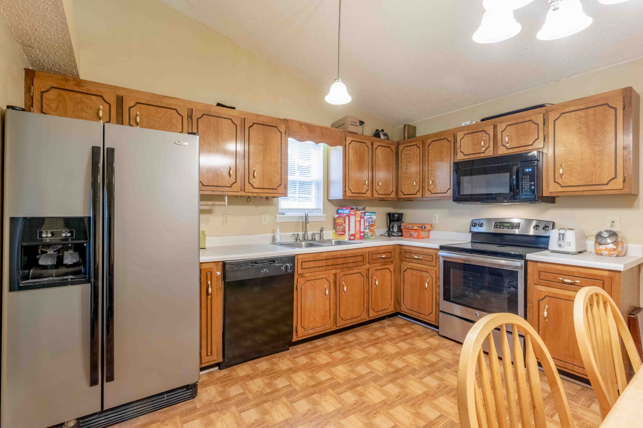 145 Bumpus Mill Road Oak Grove, KY 42262 - Photo 13 of 31 a kitchen with granite countertop a refrigerator stove top oven a sink and dishwasher