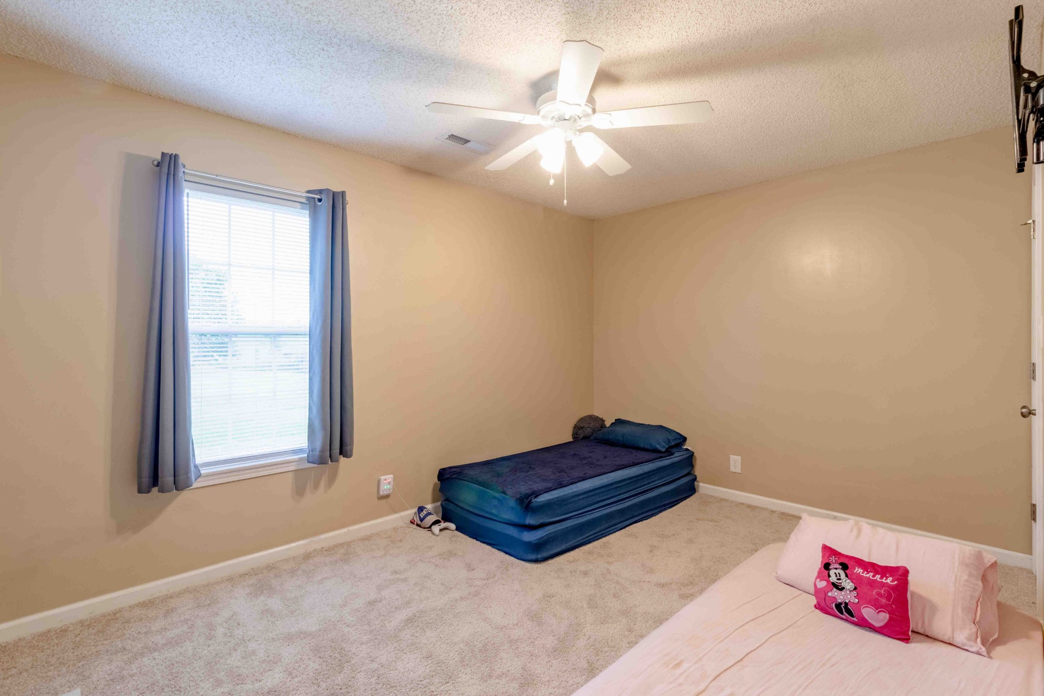 145 Bumpus Mill Road Oak Grove, KY 42262 - Photo 21 of 31 a room with a bed and a chandelier