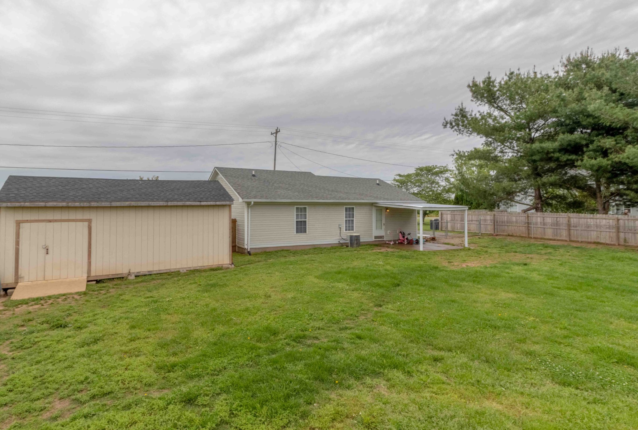 145 Bumpus Mill Road Oak Grove, KY 42262 - Photo 27 of 31 a view of a house with a backyard