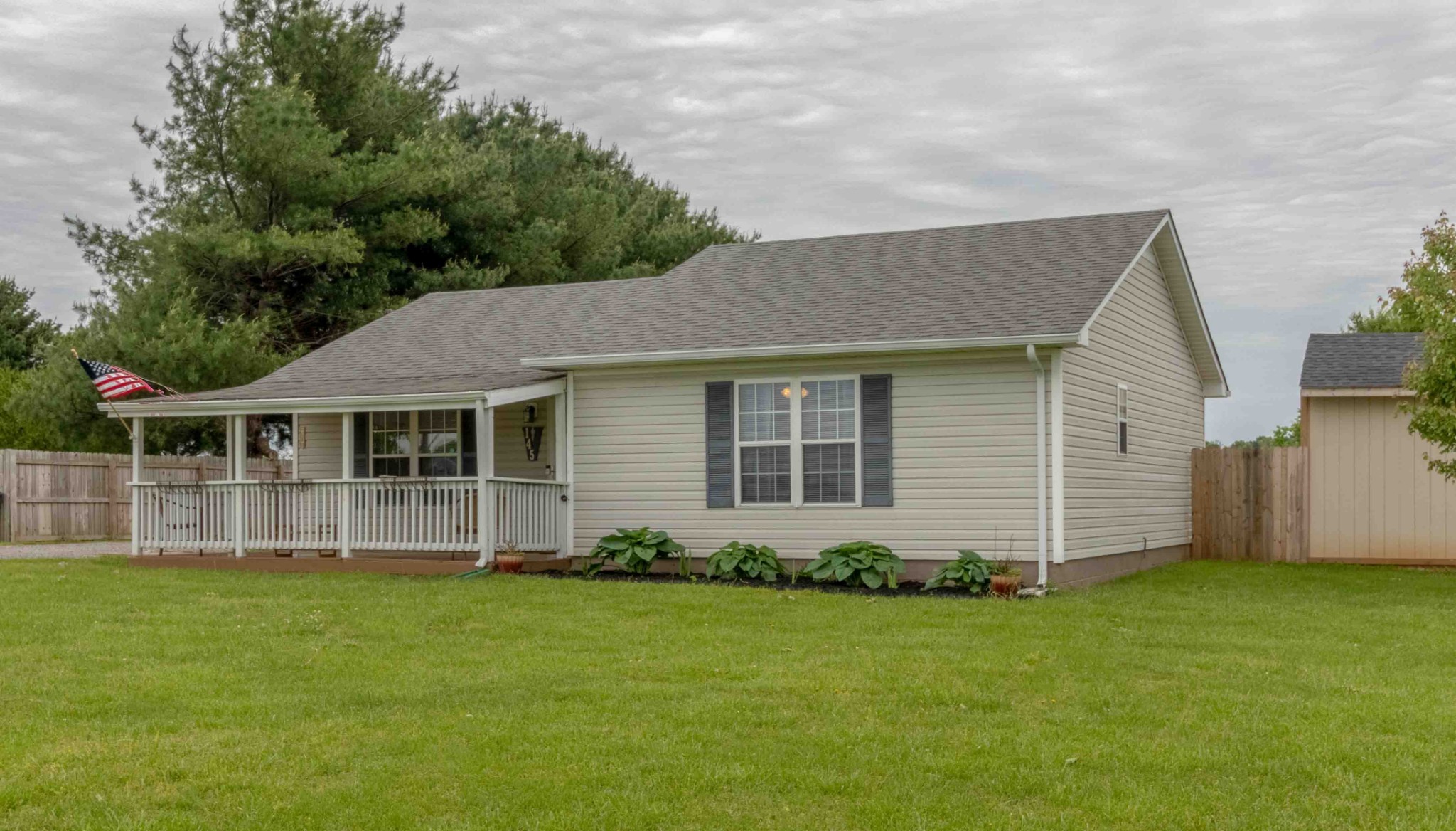 145 Bumpus Mill Road Oak Grove, KY 42262 - Photo 5 of 31 a front view of a house with a garden