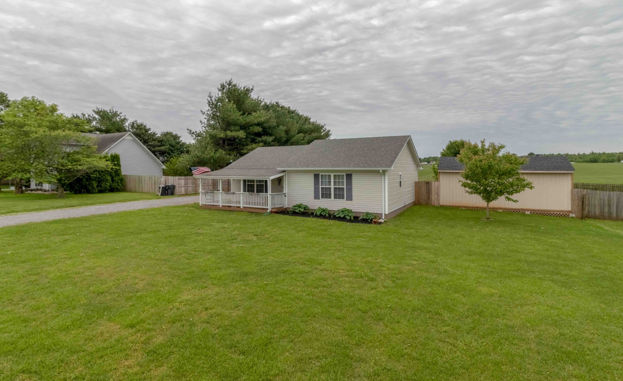 145 Bumpus Mill Road Oak Grove, KY 42262 - Photo 6 of 31 a front view of house with yard and trees in the background