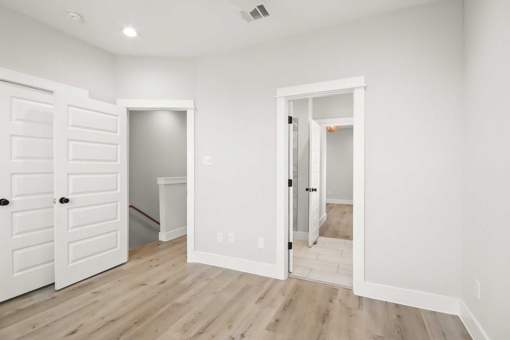 2105 Sam Wilson Street, Unit E Houston, TX 77020 - Photo 12 of 30 wooden floor in an empty room