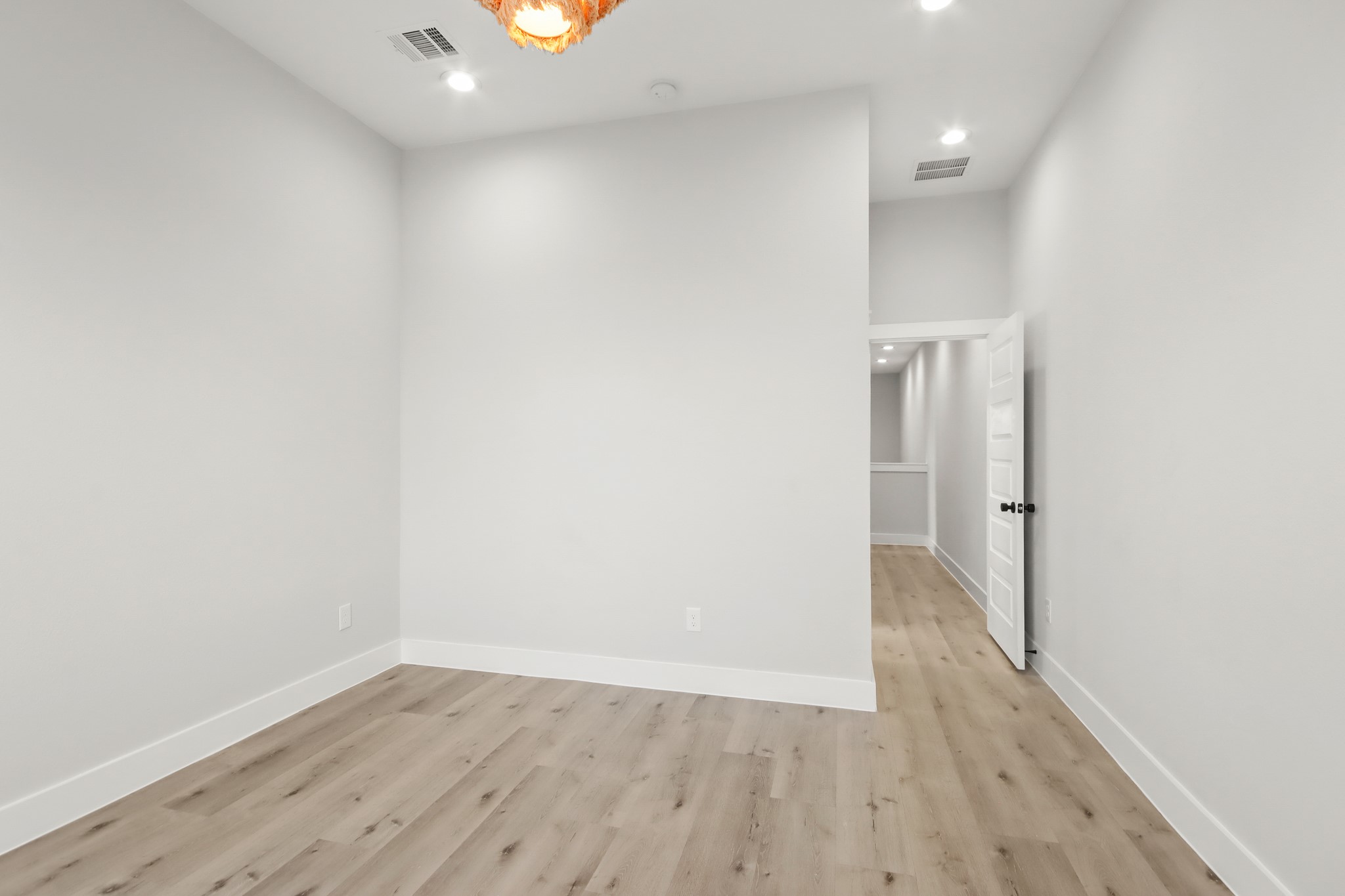 2105 Sam Wilson Street, Unit E Houston, TX 77020 - Photo 19 of 30 a view of a room with wooden floor