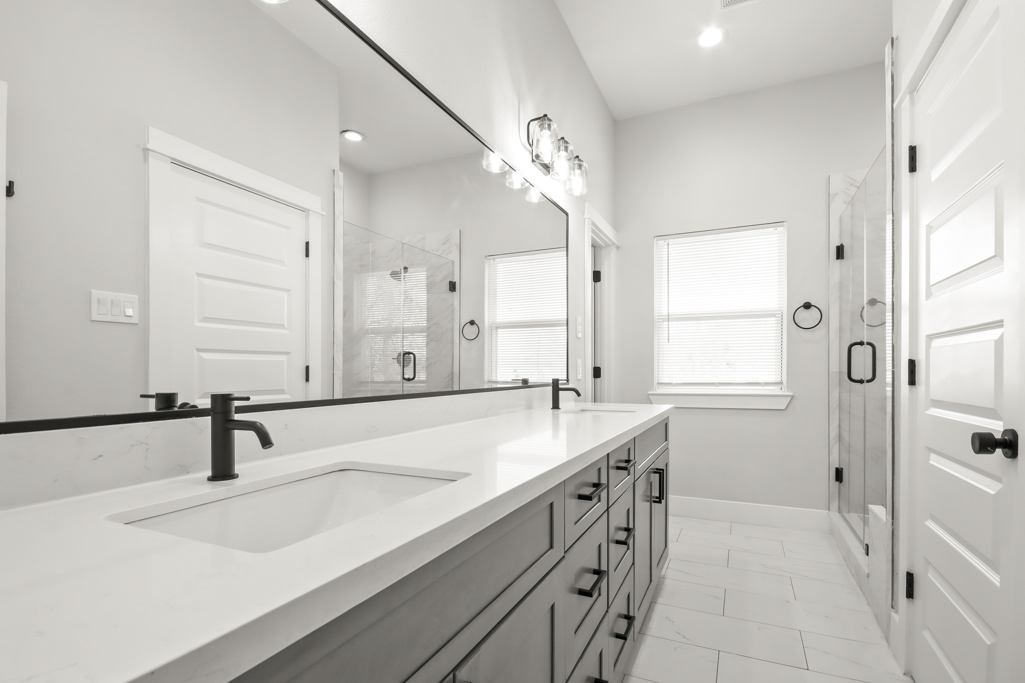2105 Sam Wilson Street, Unit E Houston, TX 77020 - Photo 20 of 30 a bathroom with a sink double vanity and a mirror