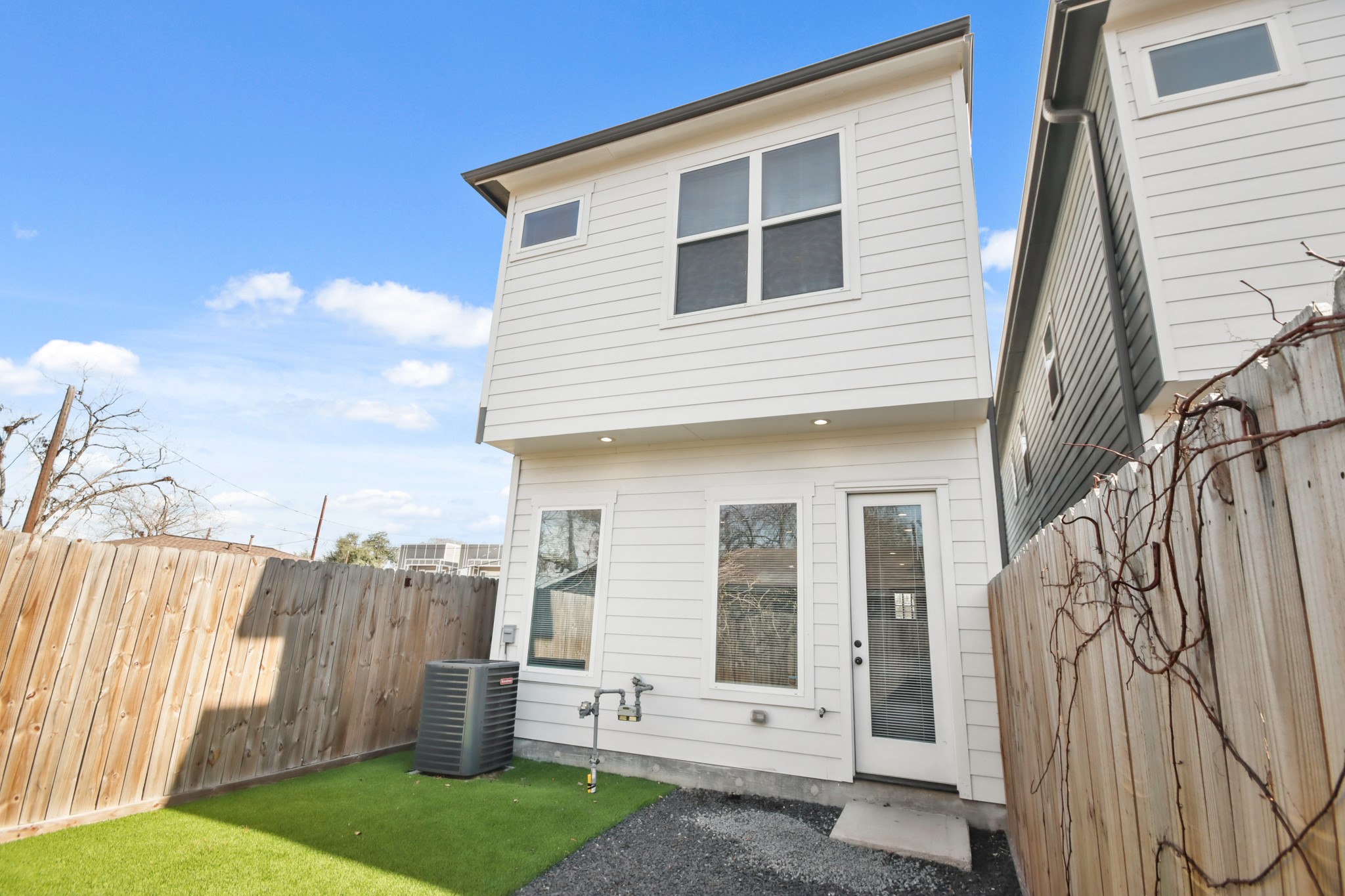 2105 Sam Wilson Street, Unit E Houston, TX 77020 - Photo 23 of 30 a view of a house with a backyard
