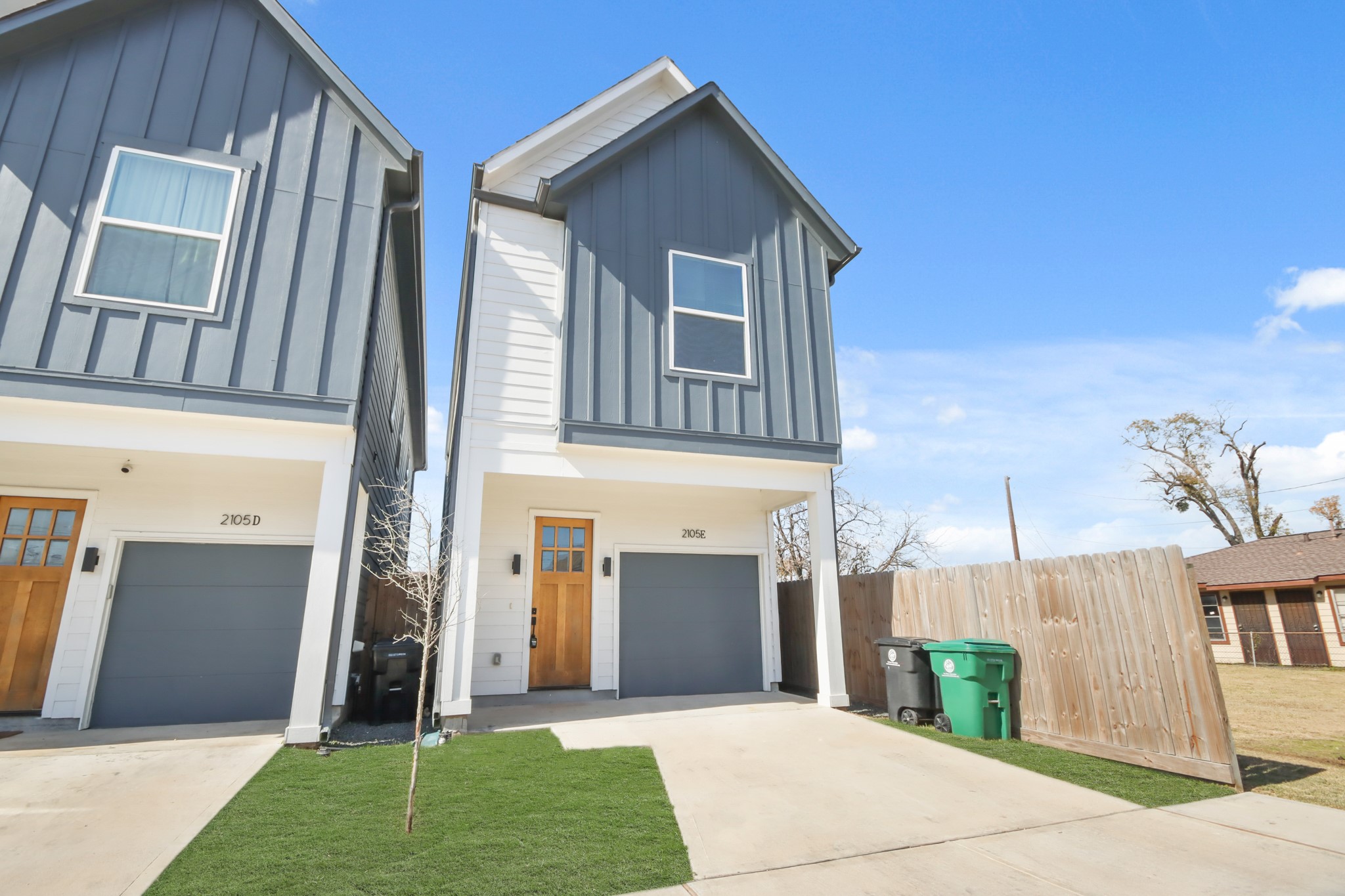 2105 Sam Wilson Street, Unit E Houston, TX 77020 - Photo 27 of 30 a front view of a house with a yard