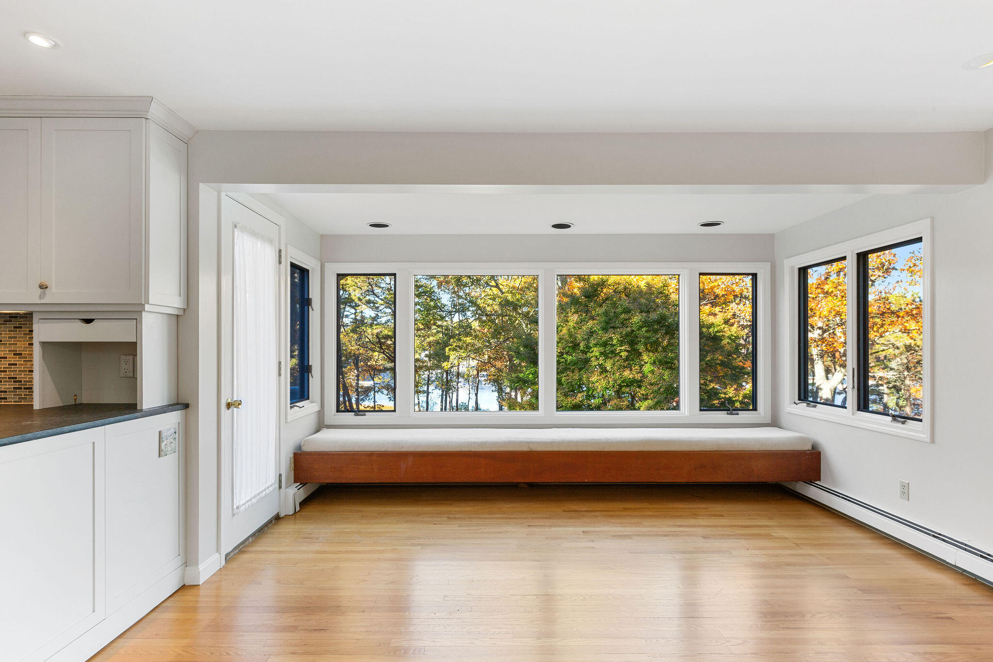 48 Namequoit Road Orleans, MA 02653 - Photo 20 of 97 a view of a room with window and an open kitchen