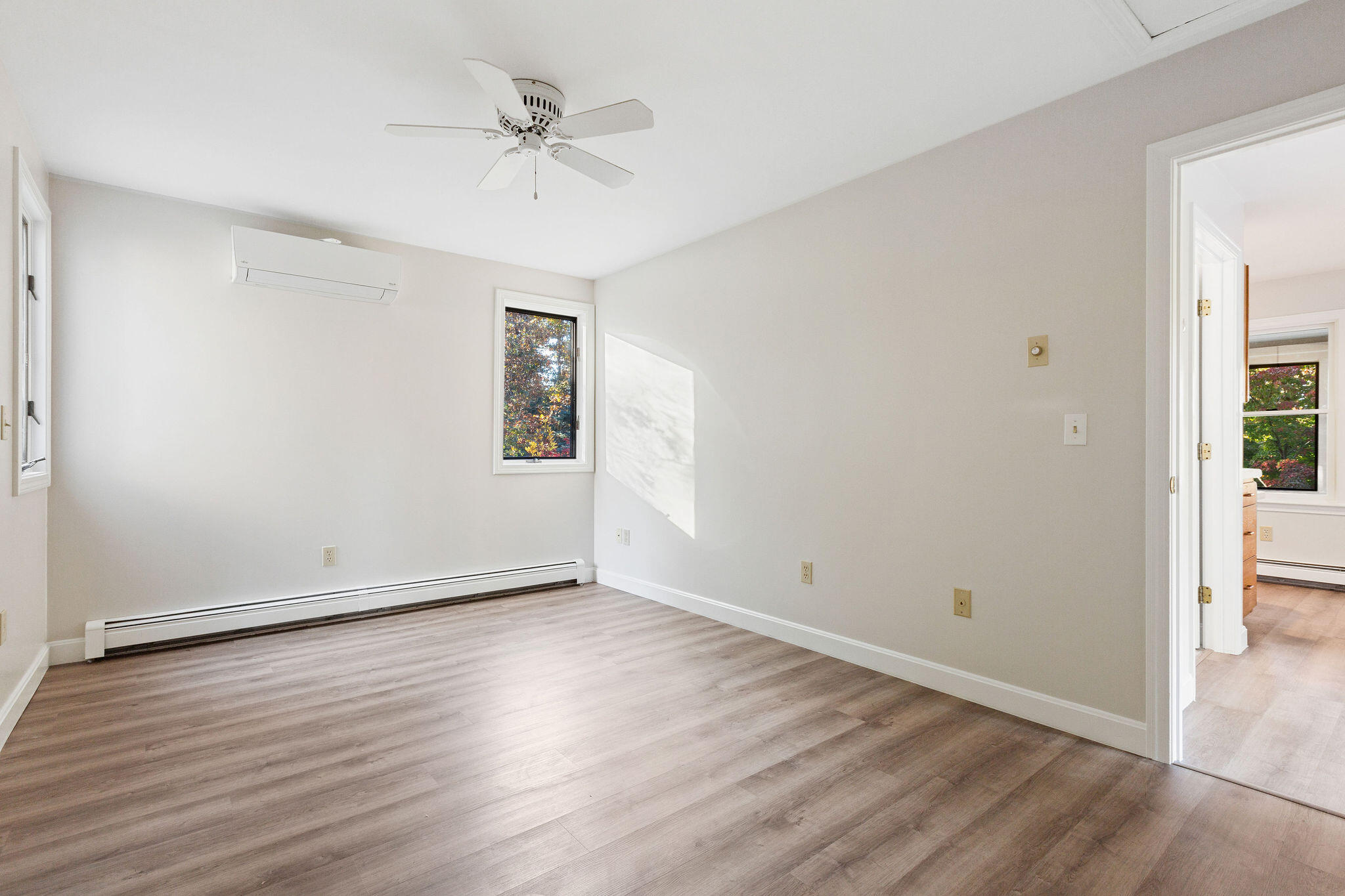 48 Namequoit Road Orleans, MA 02653 - Photo 49 of 97 wooden floor in an empty room with a window