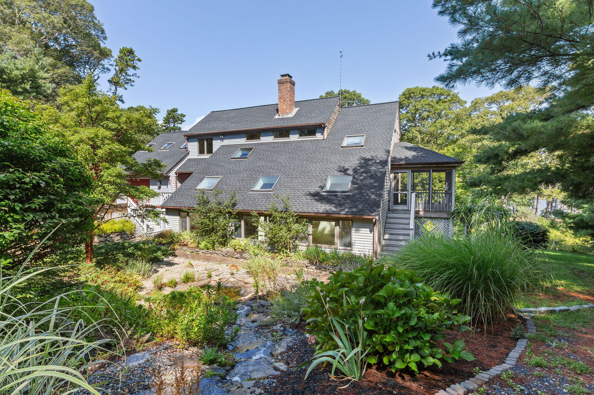 48 Namequoit Road Orleans, MA 02653 - Photo 83 of 97 an aerial view of a house with a garden