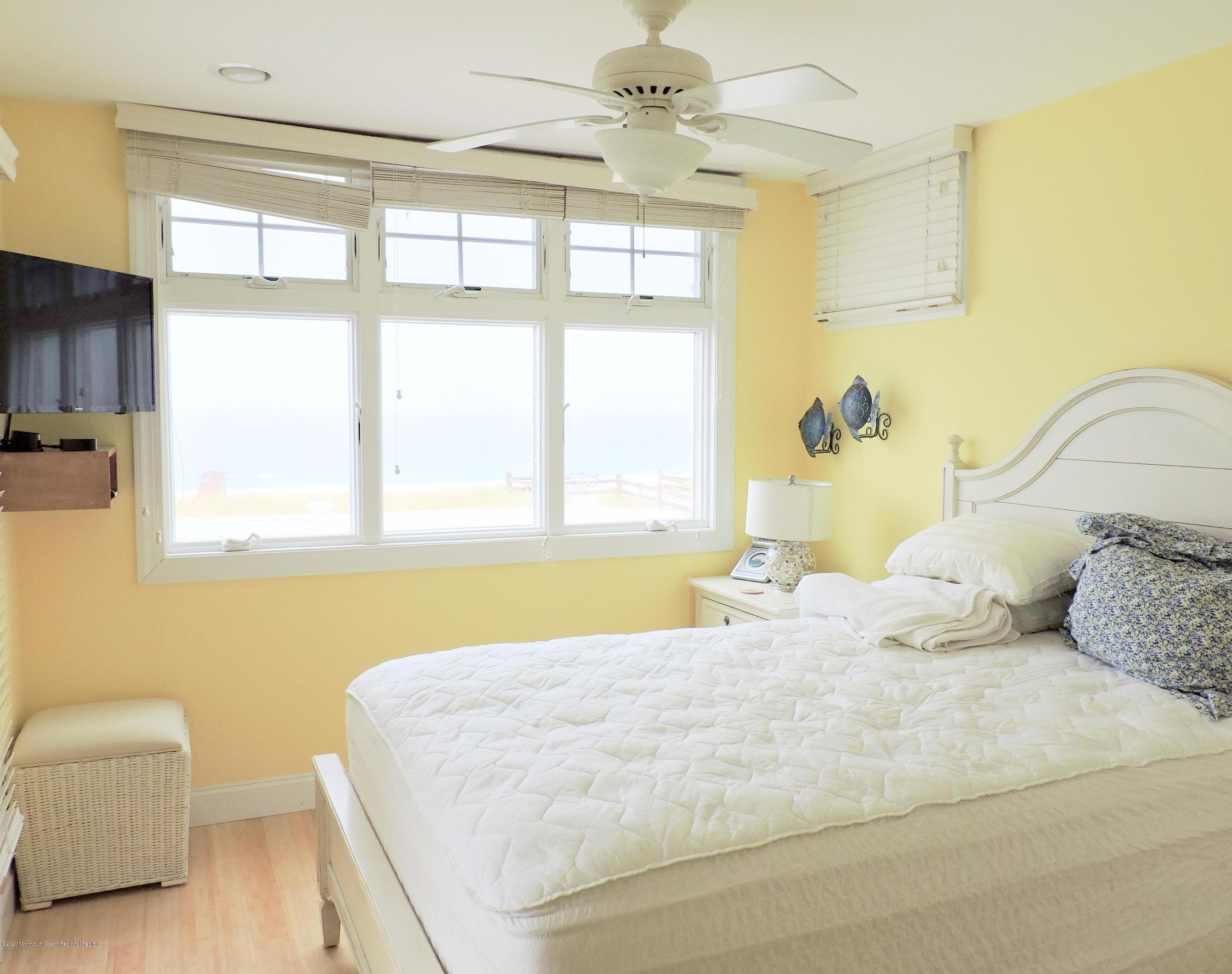 3436 Ocean Road Lavallette, NJ 08735 - Photo 11 of 24 a bedroom with a bed and a couch