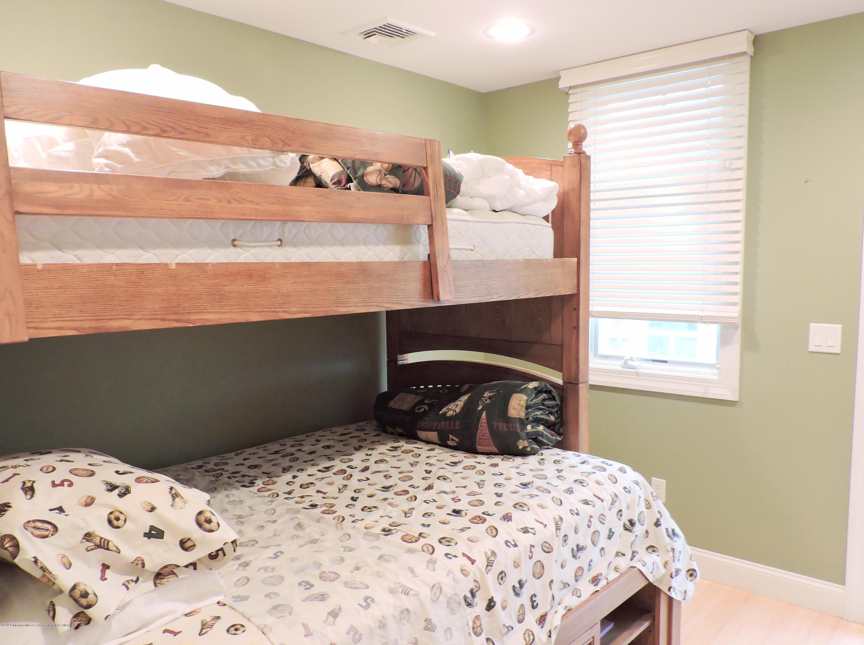3436 Ocean Road Lavallette, NJ 08735 - Photo 13 of 24 a bedroom with a bed and a window