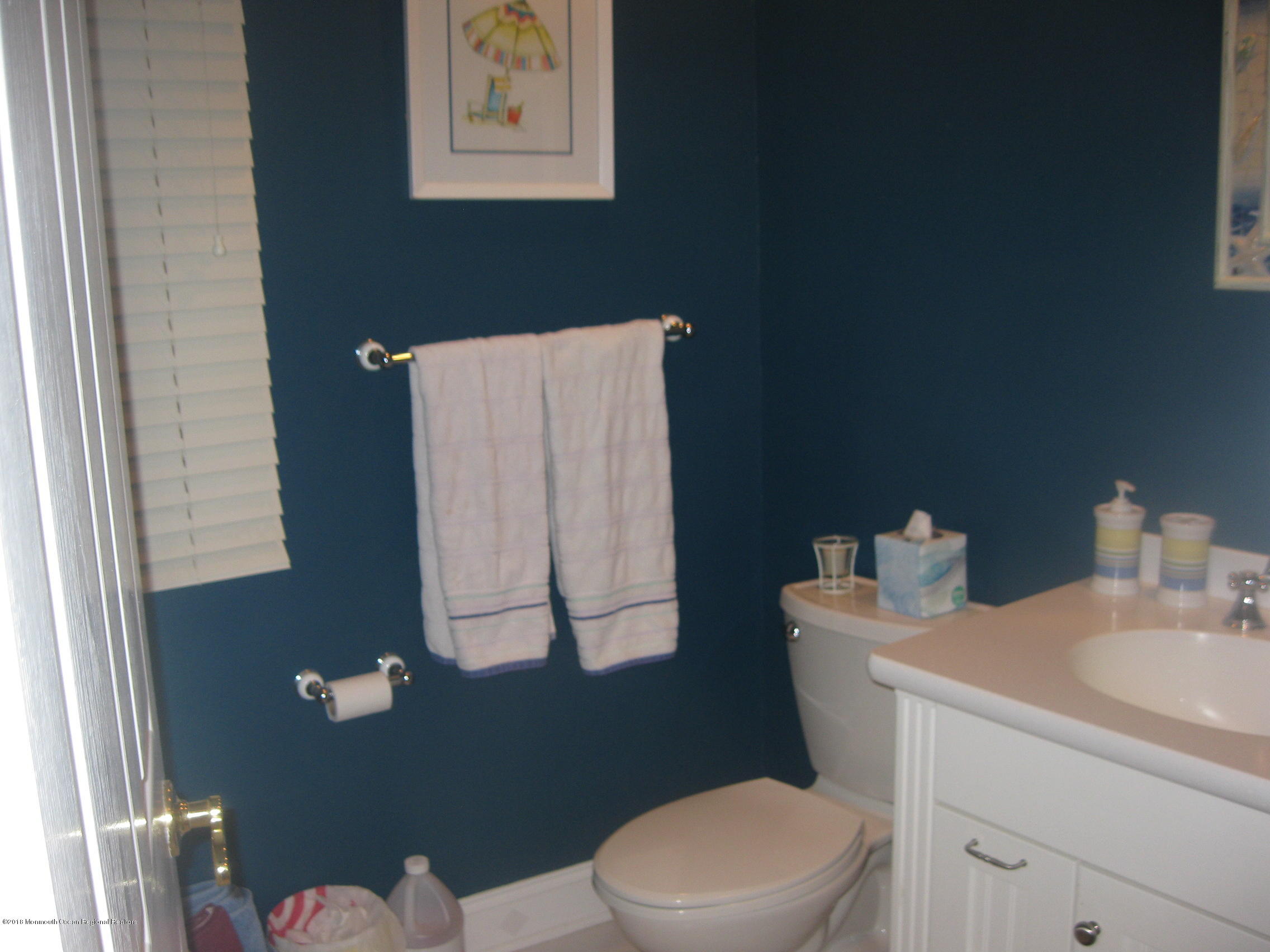 3436 Ocean Road Lavallette, NJ 08735 - Photo 15 of 24 a white toilet sitting next to a bathroom sink