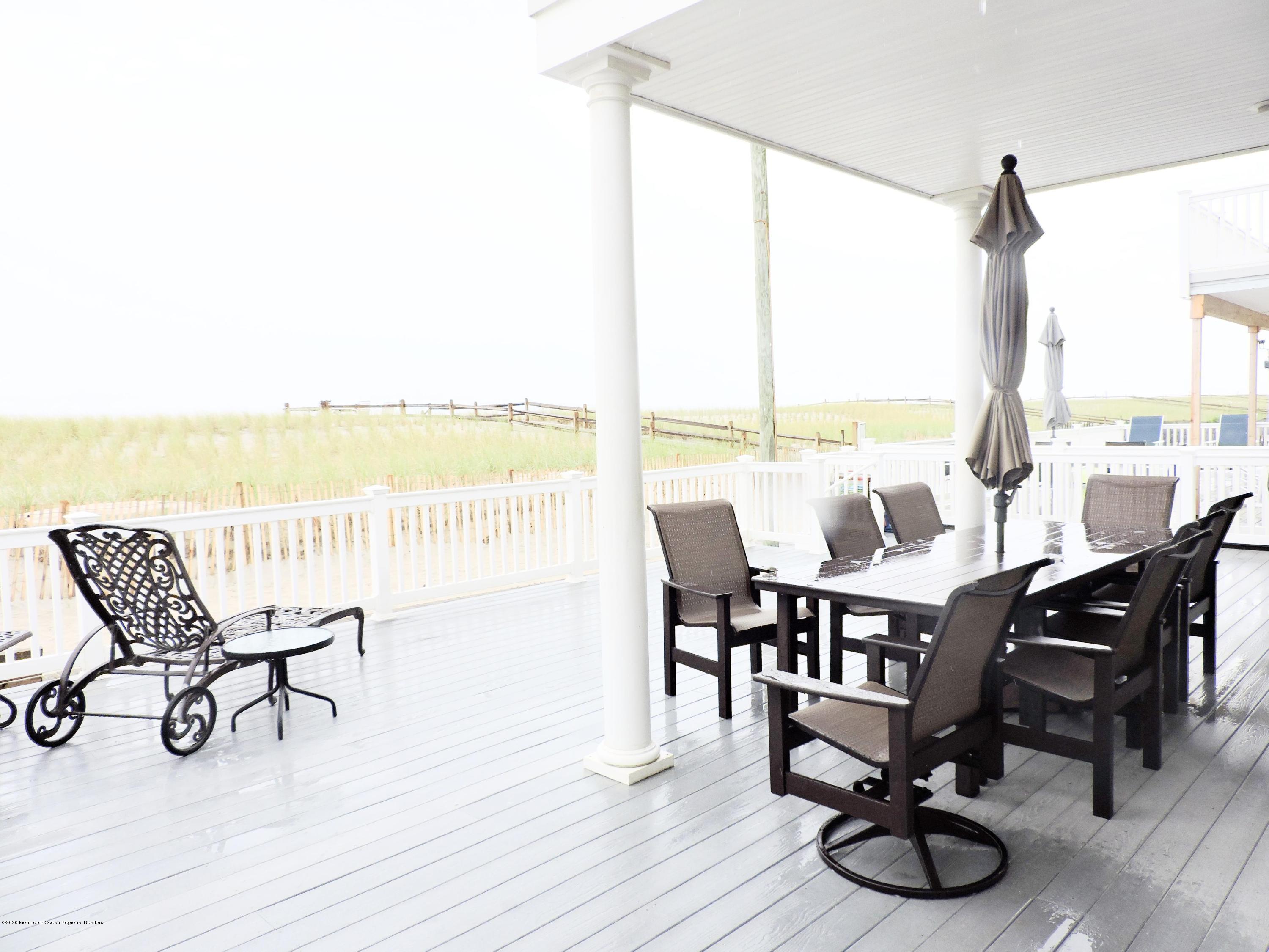 3436 Ocean Road Lavallette, NJ 08735 - Photo 16 of 24 a view of a dining room with furniture window and wooden floor
