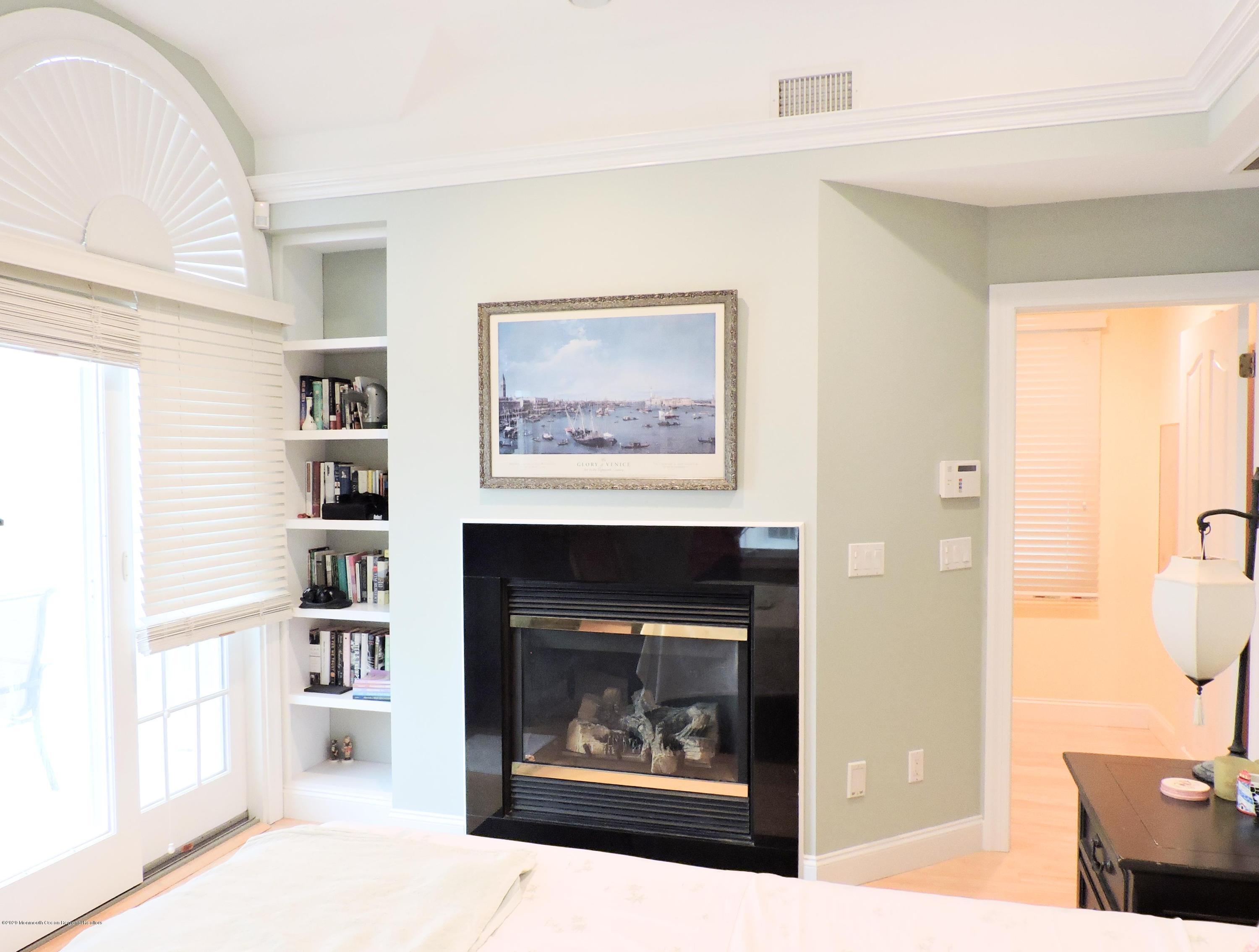 3436 Ocean Road Lavallette, NJ 08735 - Photo 7 of 24 a living room with furniture and a fireplace