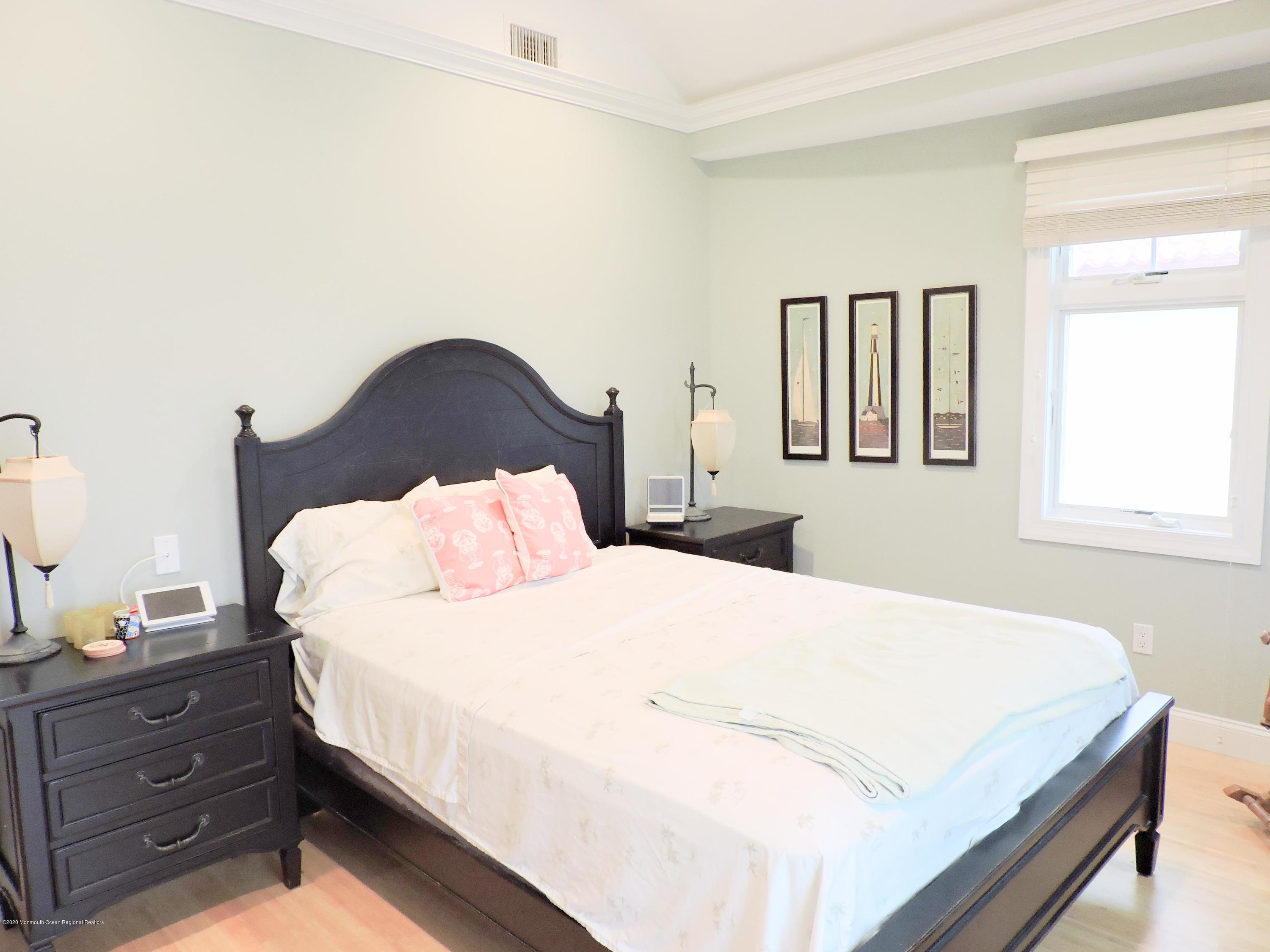 3436 Ocean Road Lavallette, NJ 08735 - Photo 9 of 24 a bedroom with a bed and window