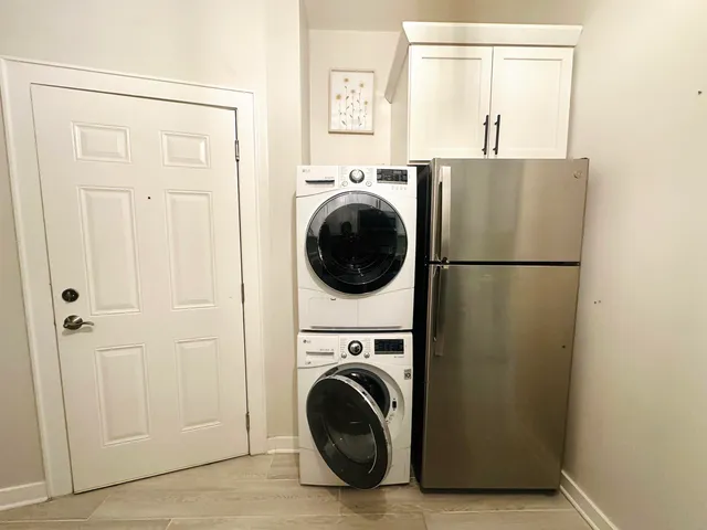 a view of a kitchen with washer and dryer