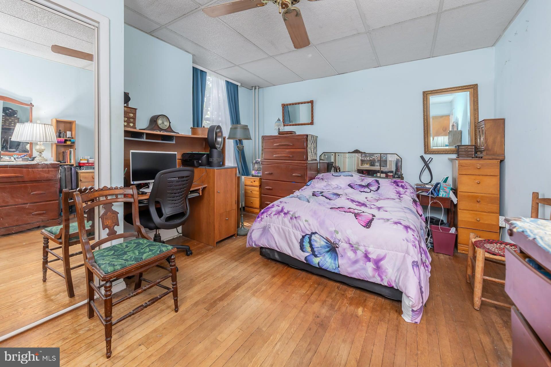 401 West Avenue Delanco, NJ 08075 - Photo 7 of 19 a bedroom with a bed and wooden floor