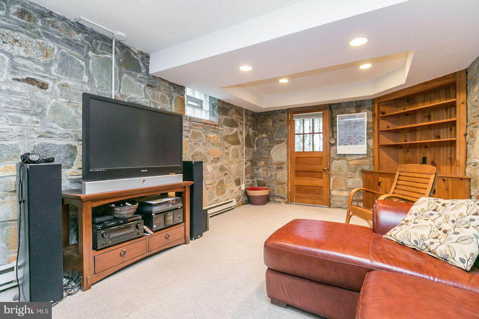 616 Hastings Road Baltimore, MD 21286 - Photo 17 of 23 a living room with furniture and a flat screen tv