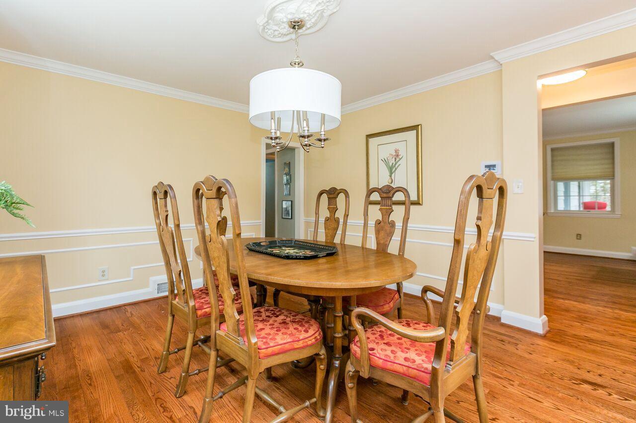 616 Hastings Road Baltimore, MD 21286 - Photo 5 of 23 a view of a dining room with furniture and wooden floor