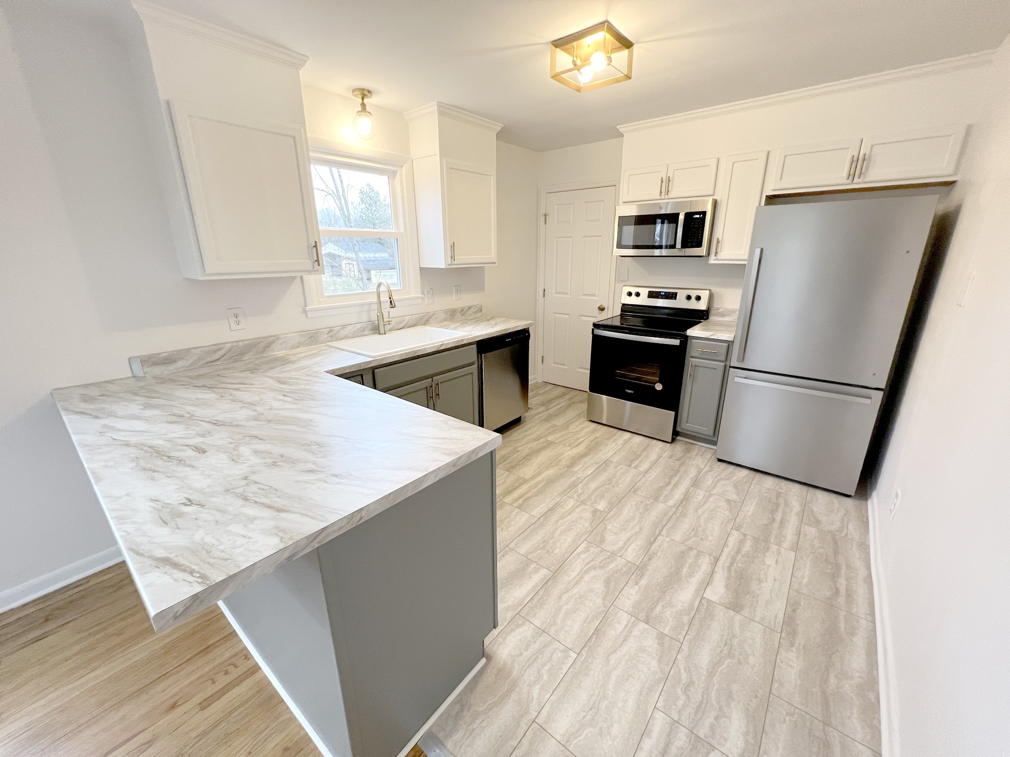 505 High Point Road Clarksville, TN 37042 - Photo 11 of 39 a kitchen with a refrigerator a sink and a stove
