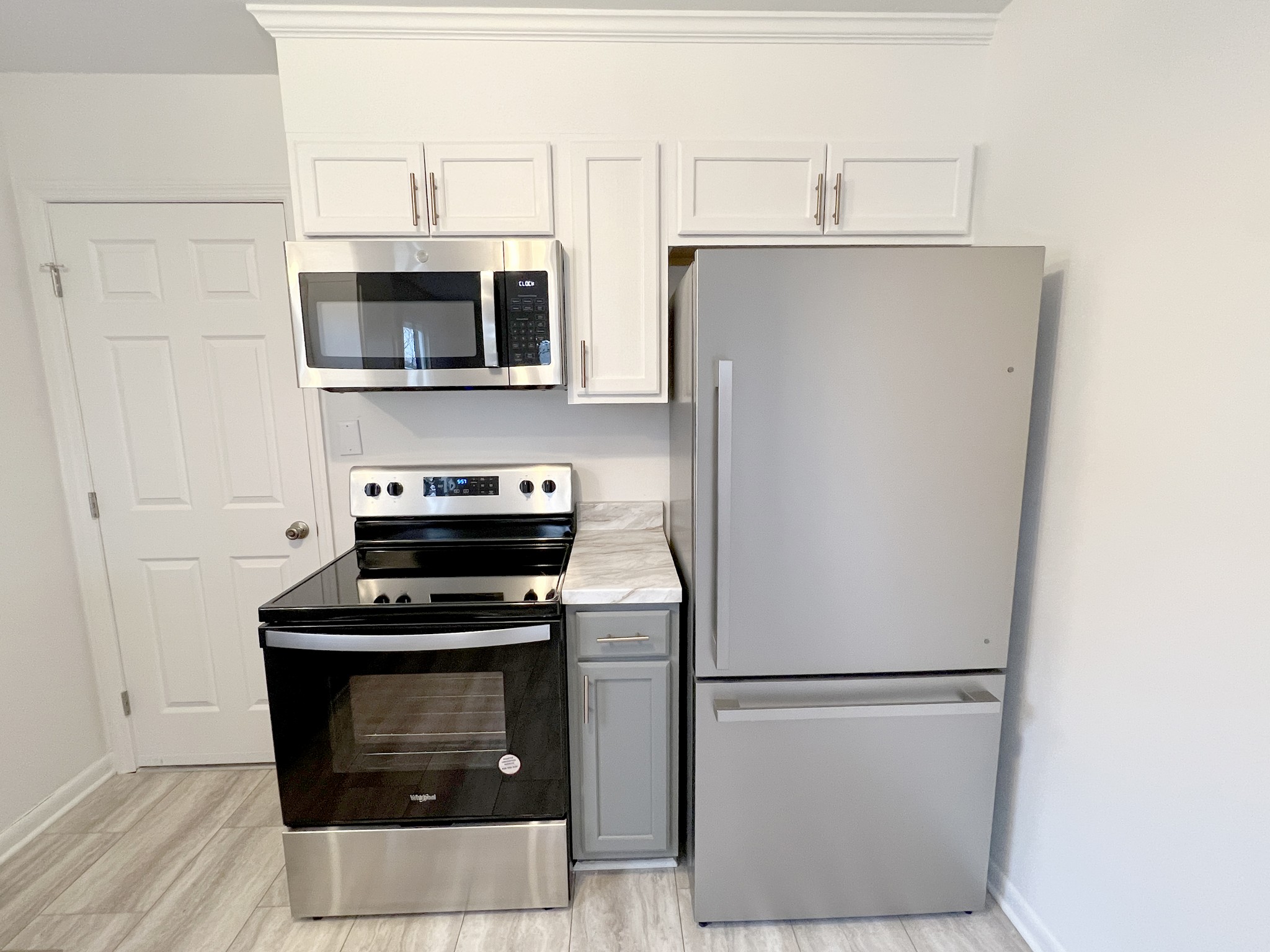 505 High Point Road Clarksville, TN 37042 - Photo 12 of 39 a white refrigerator freezer and a stove sitting inside of a kitchen