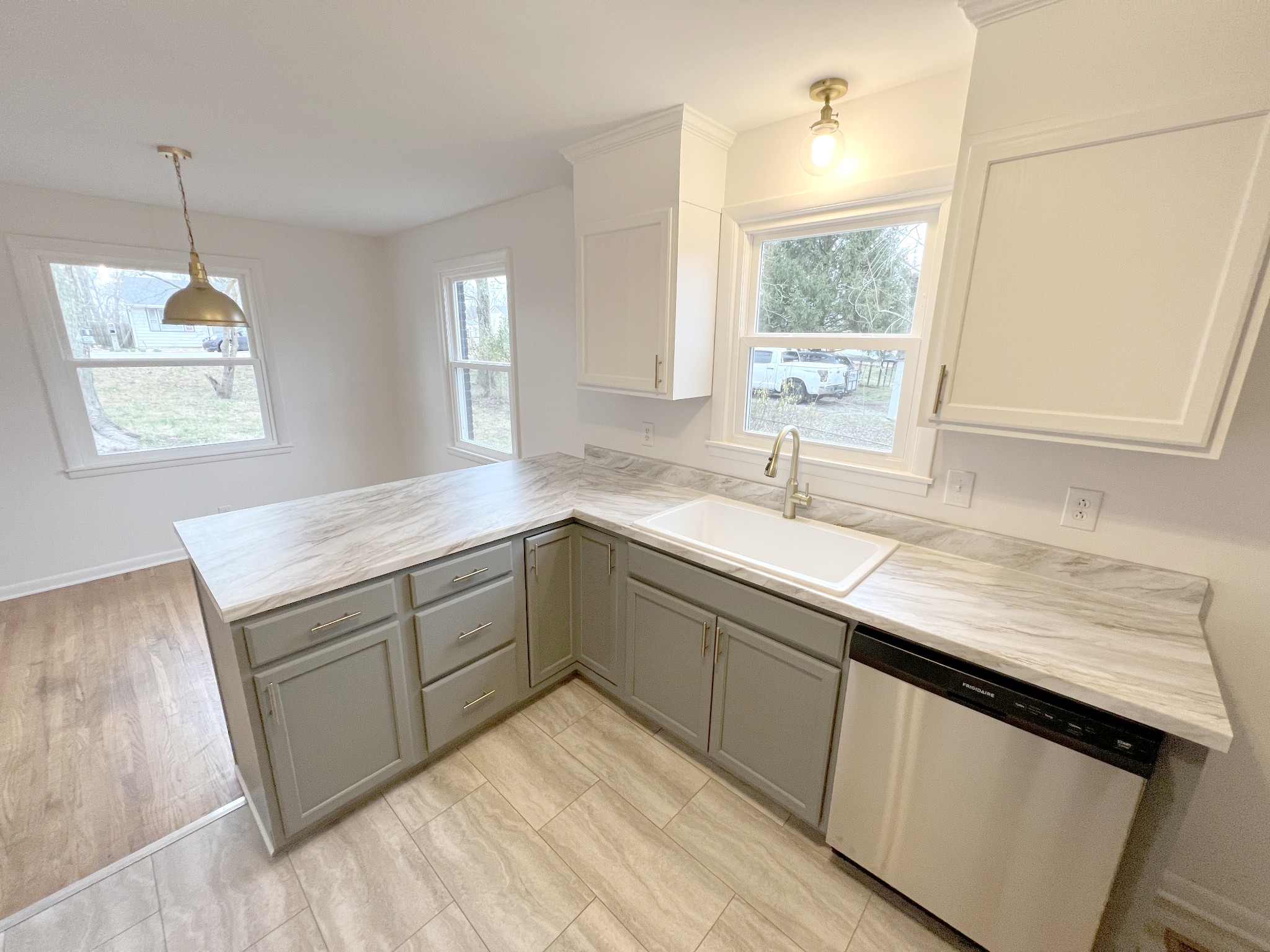 505 High Point Road Clarksville, TN 37042 - Photo 13 of 39 a kitchen with a sink window and cabinets