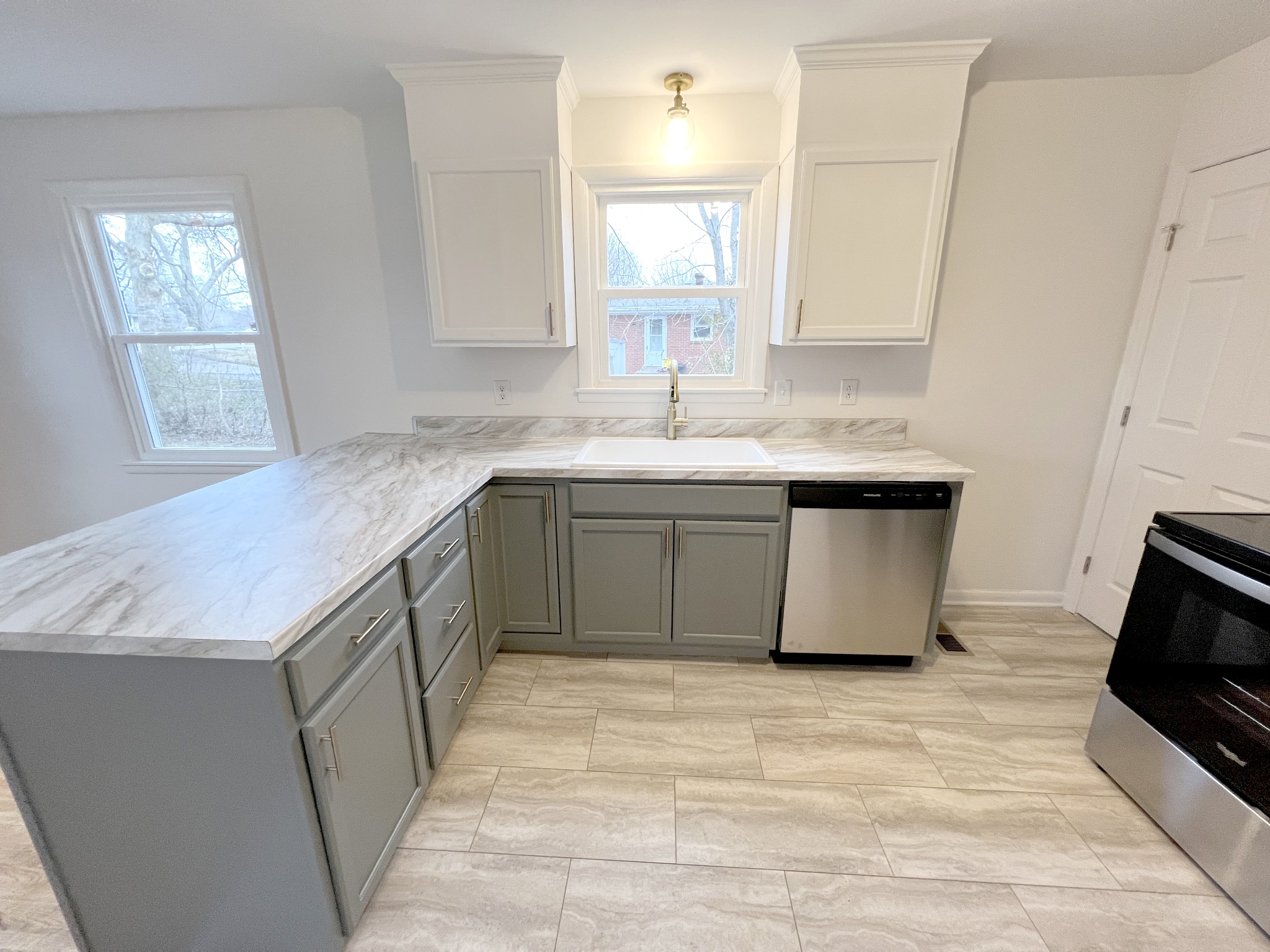 505 High Point Road Clarksville, TN 37042 - Photo 14 of 39 a kitchen with a sink stove and cabinets