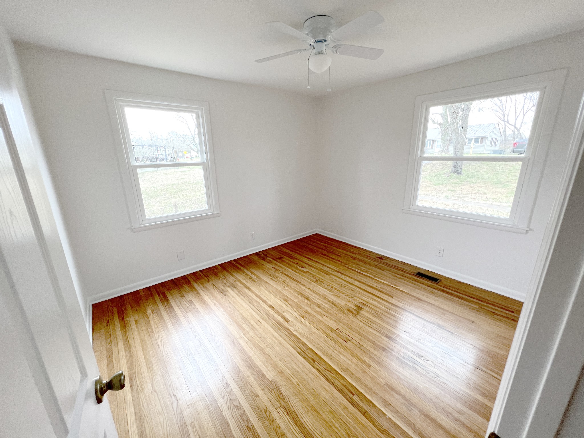 505 High Point Road Clarksville, TN 37042 - Photo 24 of 39 a view of empty room with wooden floor and fan