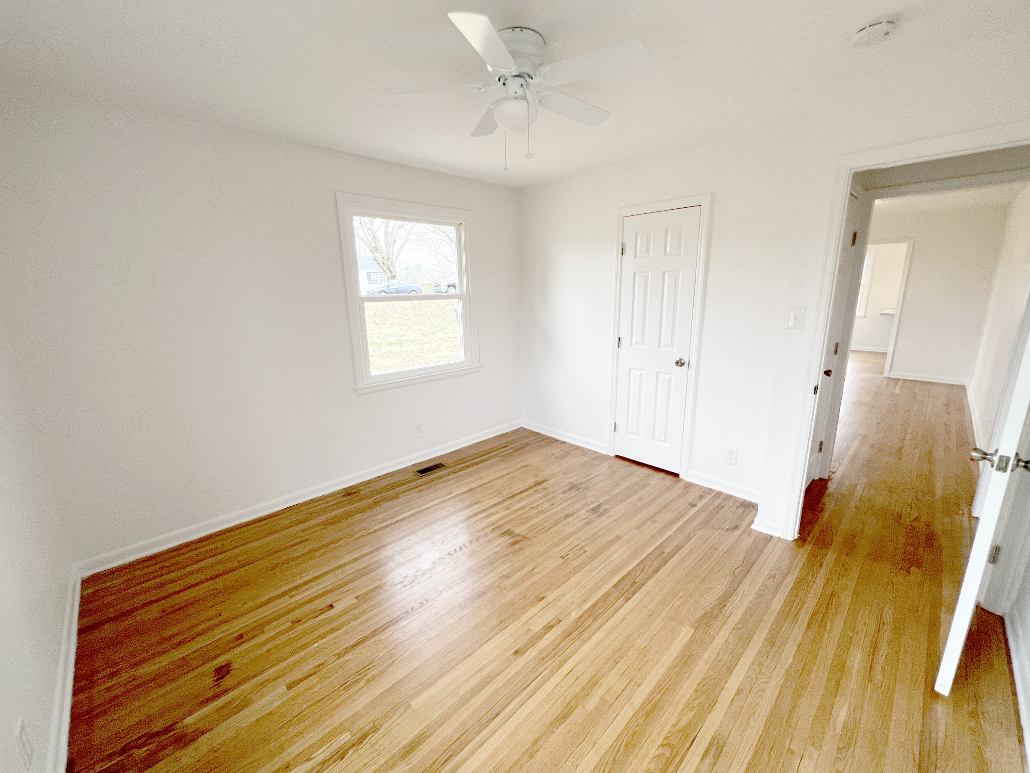 505 High Point Road Clarksville, TN 37042 - Photo 25 of 39 a view of empty room with wooden floor and fan