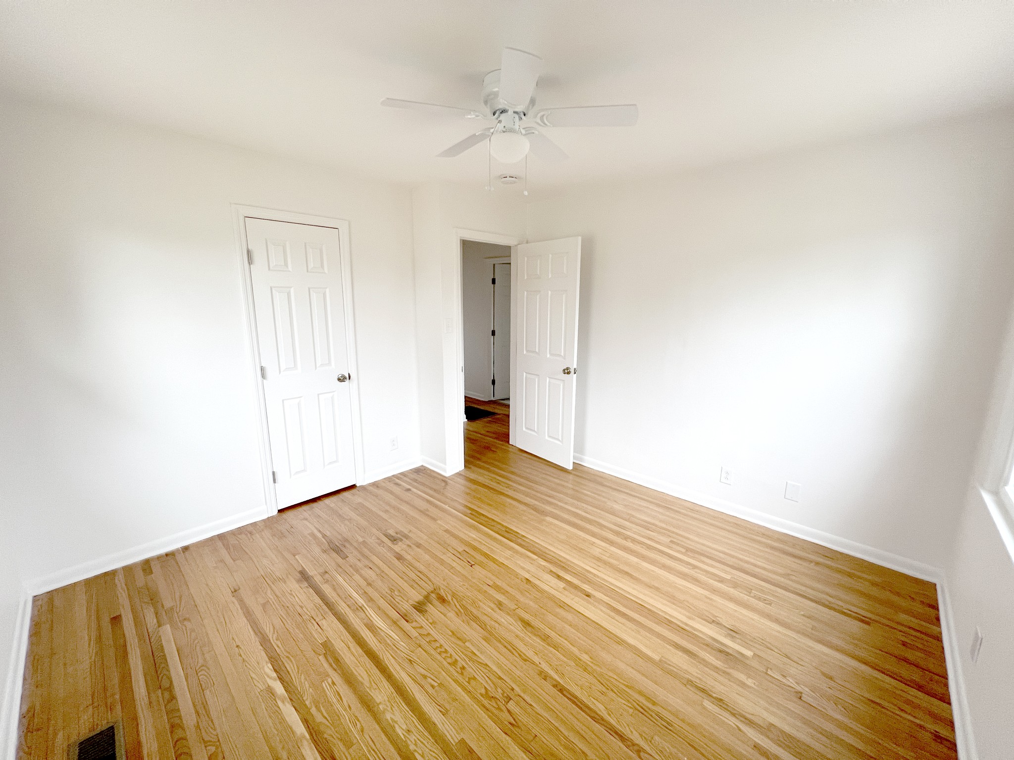 505 High Point Road Clarksville, TN 37042 - Photo 26 of 39 a view of empty room with wooden floor and fan