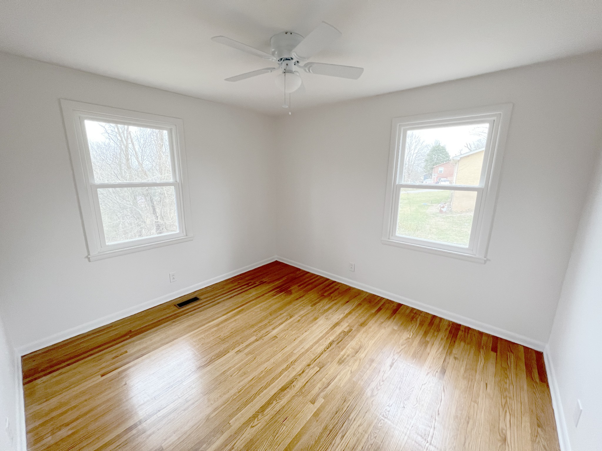 505 High Point Road Clarksville, TN 37042 - Photo 27 of 39 a view of empty room with wooden floor and fan